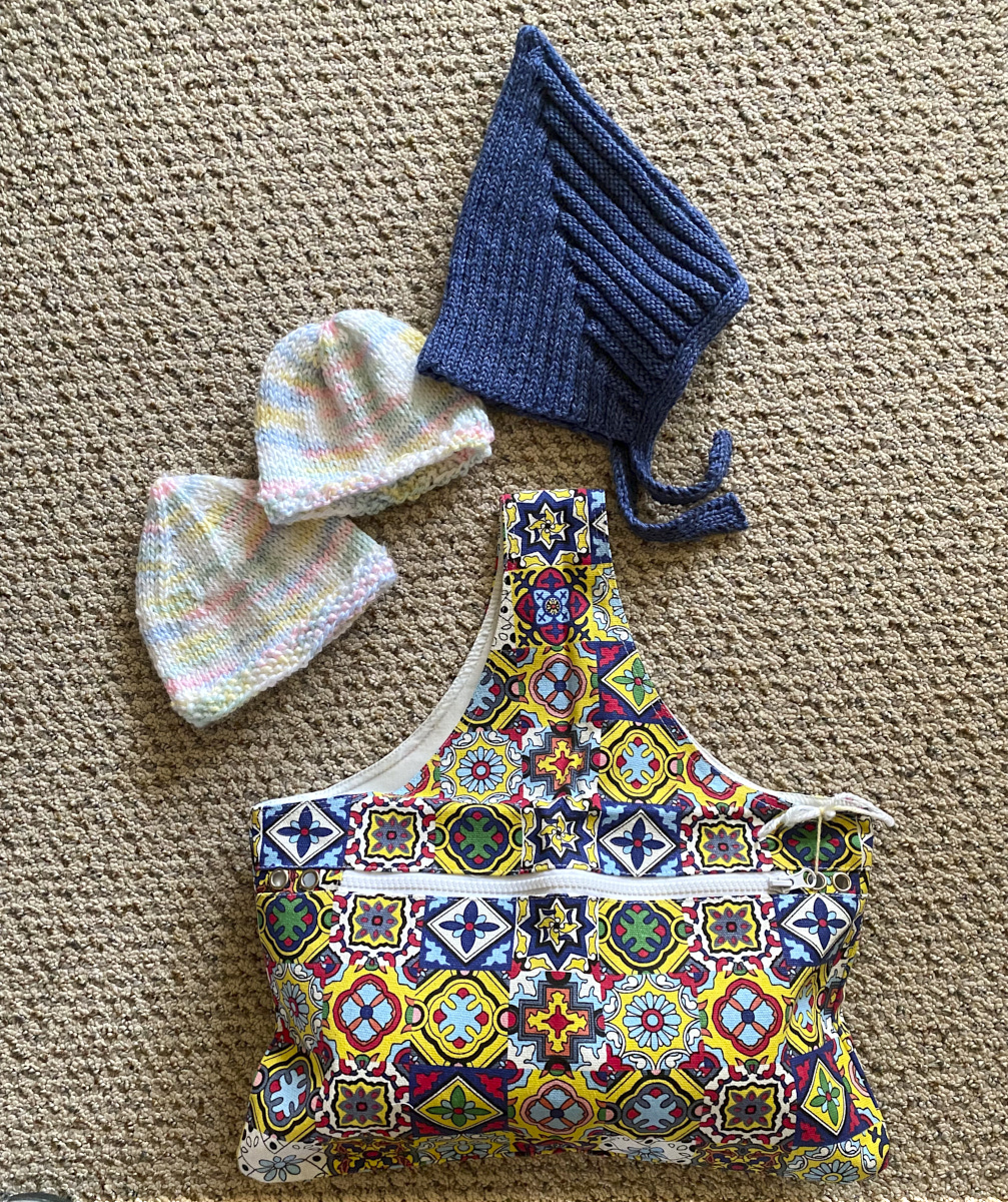 extra baby hats and knitting bag