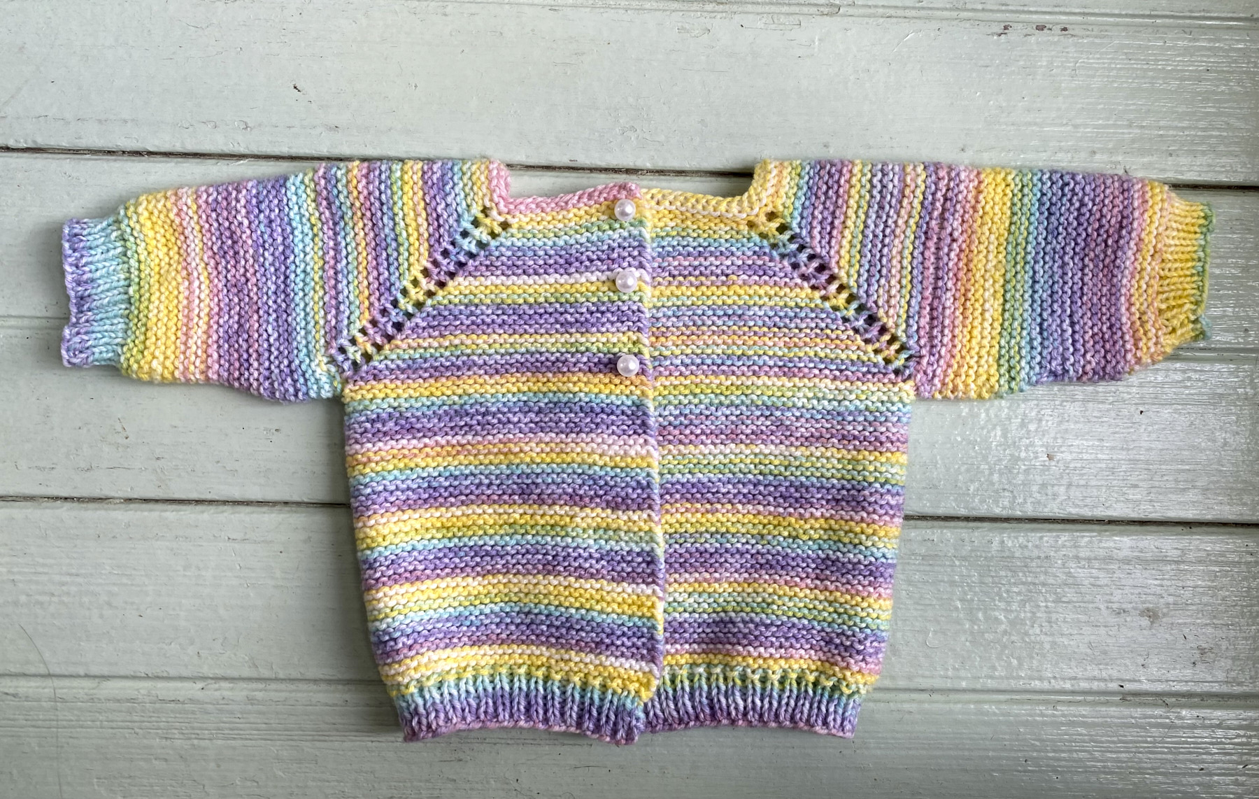 Front of multicolored baby sweater