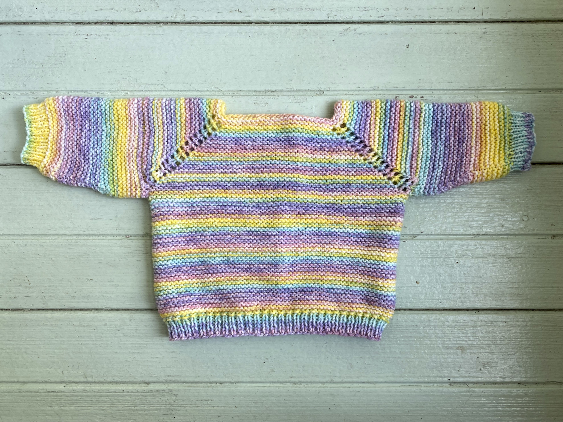 Back of multicolored baby sweater