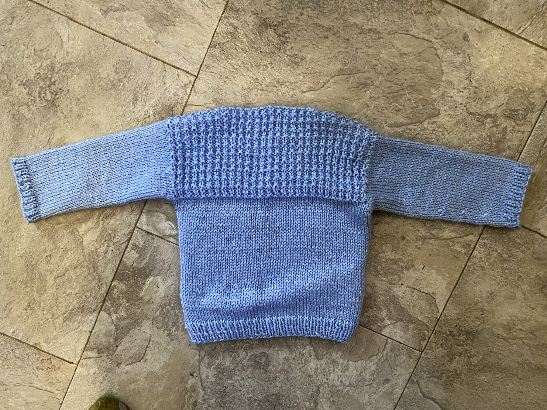 Back of blue baby sweater